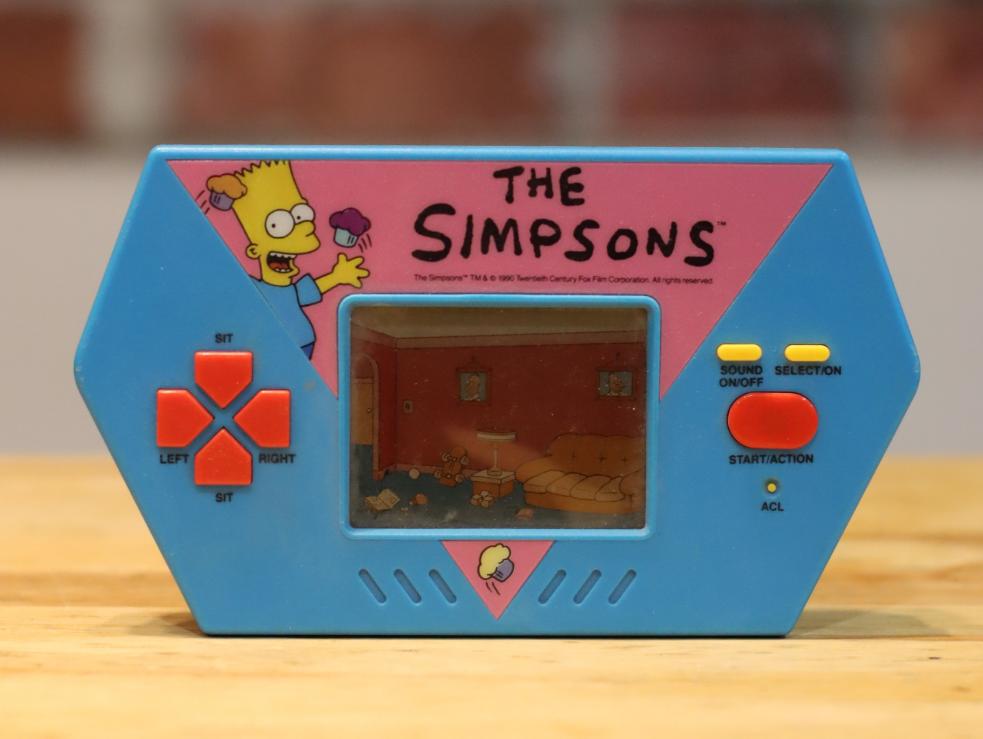 1989 Vintage Acclaim The Simpsons Cupcake Crisis LCD Handheld Video Game